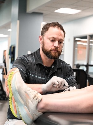 Physical therapist, Tony Garcia, working with a patient.