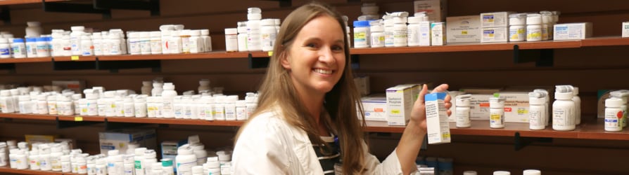 A Pill Box employee getting a patient his medication.