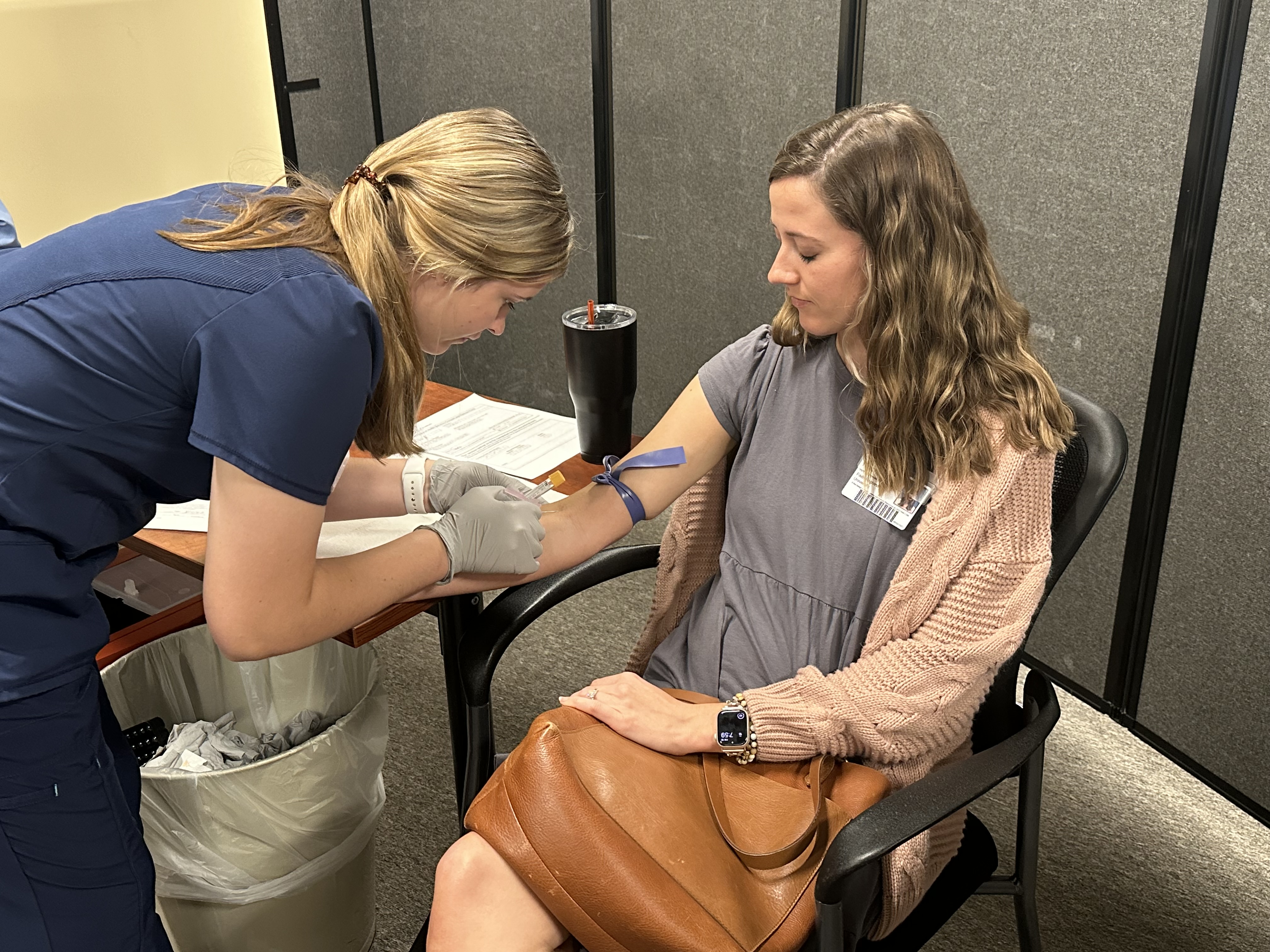 An occupational medicine nurse performing an employee flu shot.