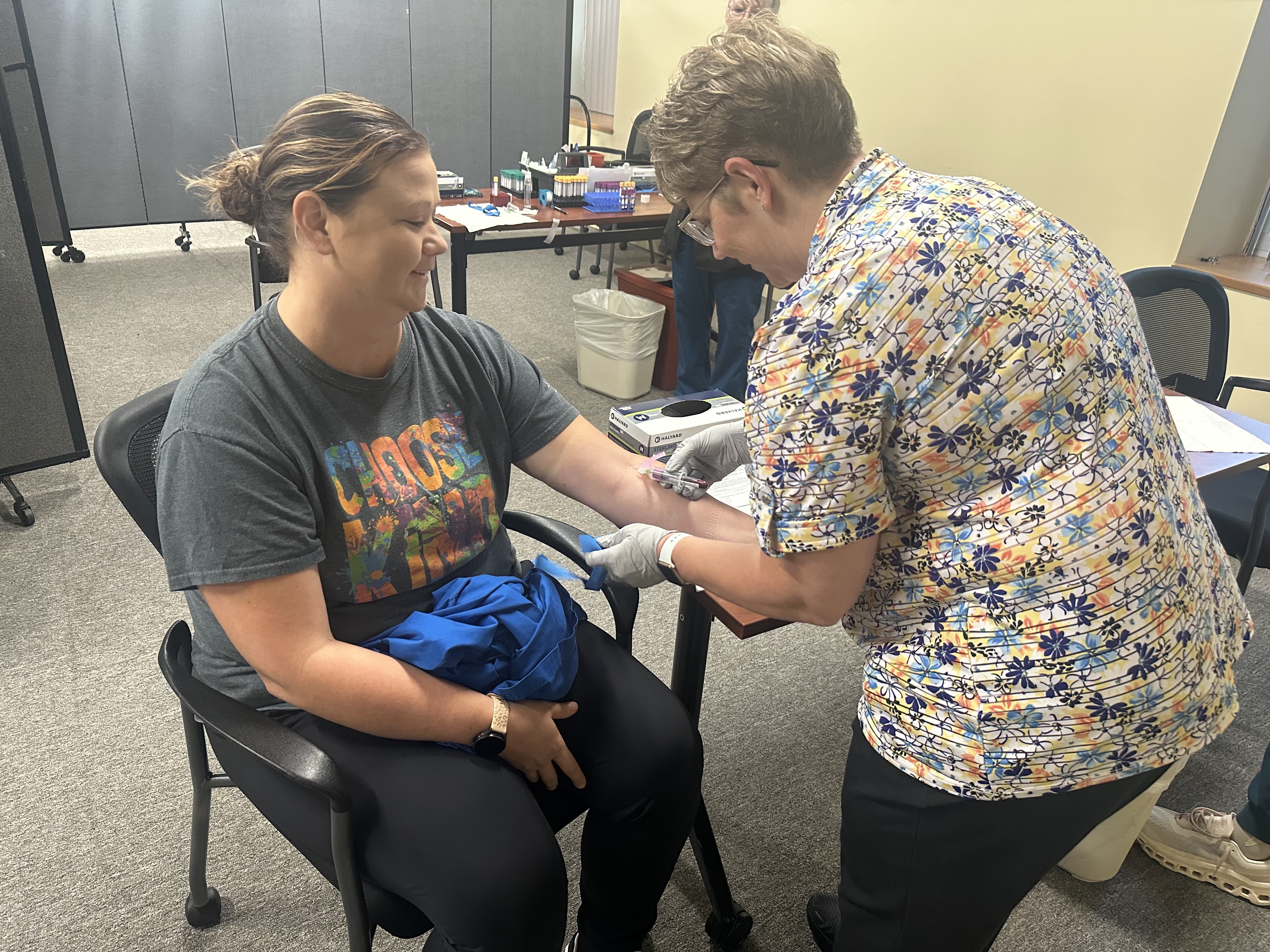 An occupational medicine nurse performing an employee blood test.