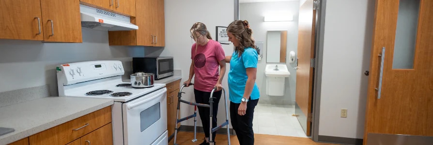 Physical therapist working with a knee replacement patient.
