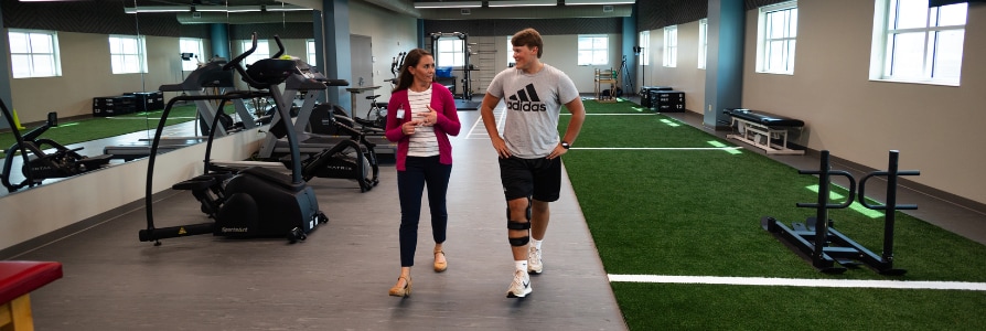 Physical therapist, Erin Baumert, working with a patient.