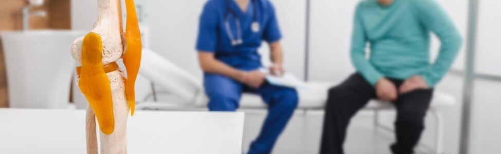 doctor with patient and knee