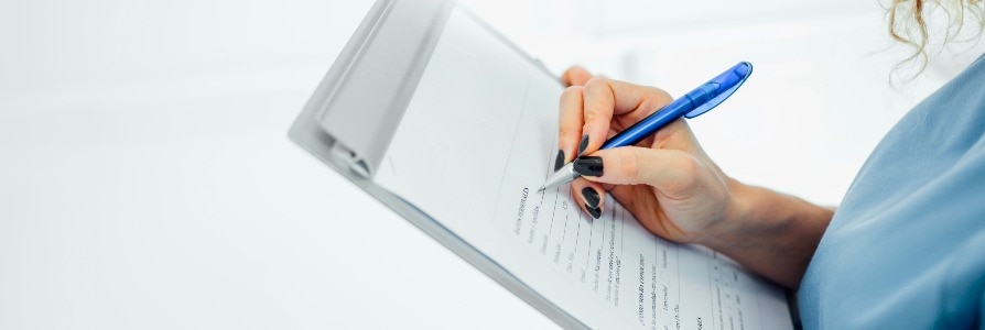 Woman filling out a patient form
