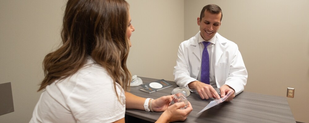 Dr. Meaike talking to a breast reconstruction patient