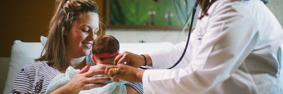 A labor and delivery nurse taking care of a mom in labor.