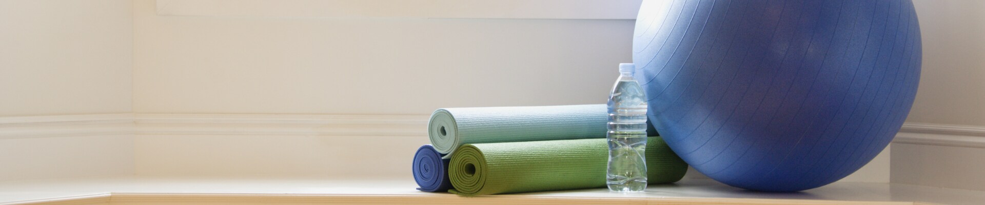 Exercise ball, water, and yoga mats