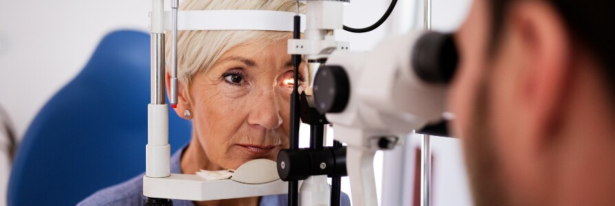 Ophthalmologist examining a patient's eyes.