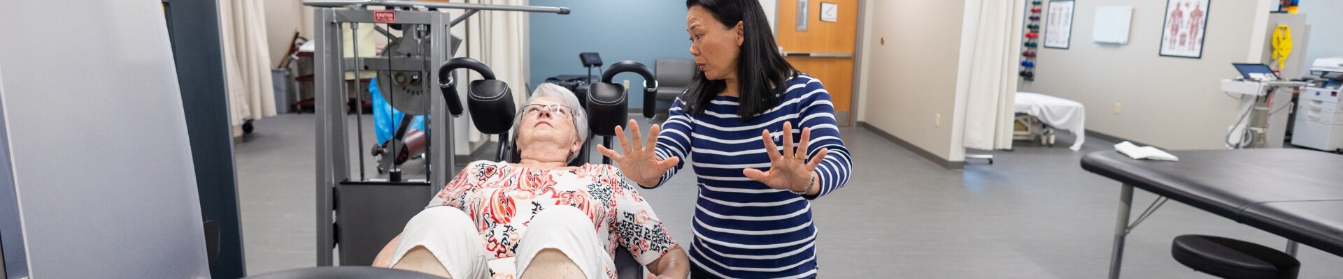 Physical Therapies assisting patient through exercises.