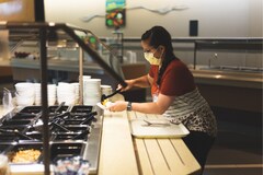 Guest selects food from cafeteria in hospital