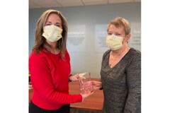 President/CEO Kelly Driscoll presents Linda Miller with her award