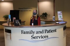Volunteer at a hospital help desk