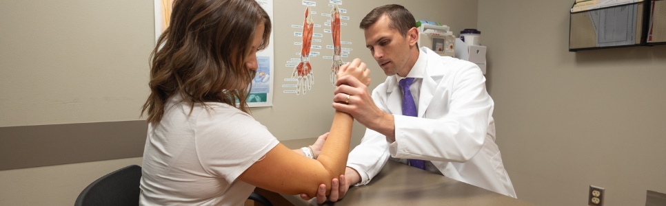 Upper extremity surgeon, Dr. Jesse Meaike with patient