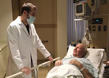 Dr. Aaron Braun, an interventional radiologist, speaking to a patient.