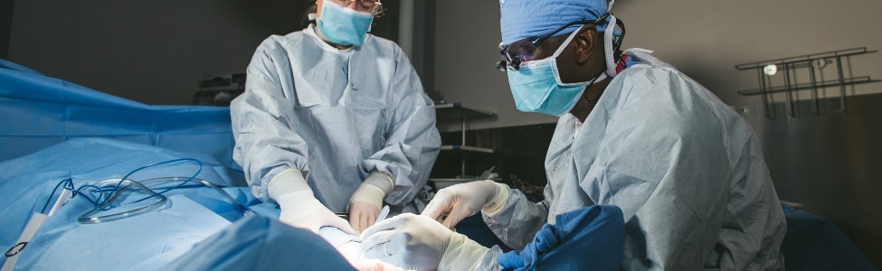 Dr Mwinyogle a vascular surgeon, performing vascular surgery