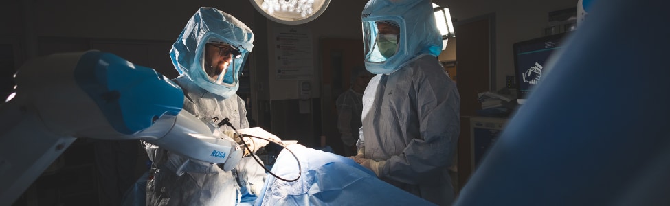 Orthopedic surgeons performing a knee replacement