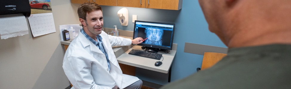 Orthopedic specialist with hip patient