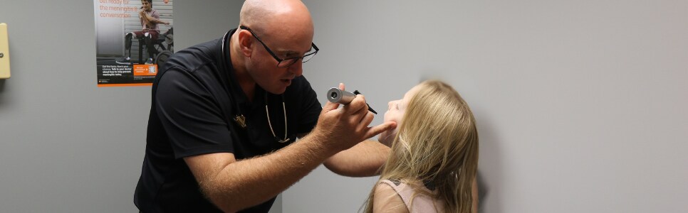 Dr. Recob with young patient