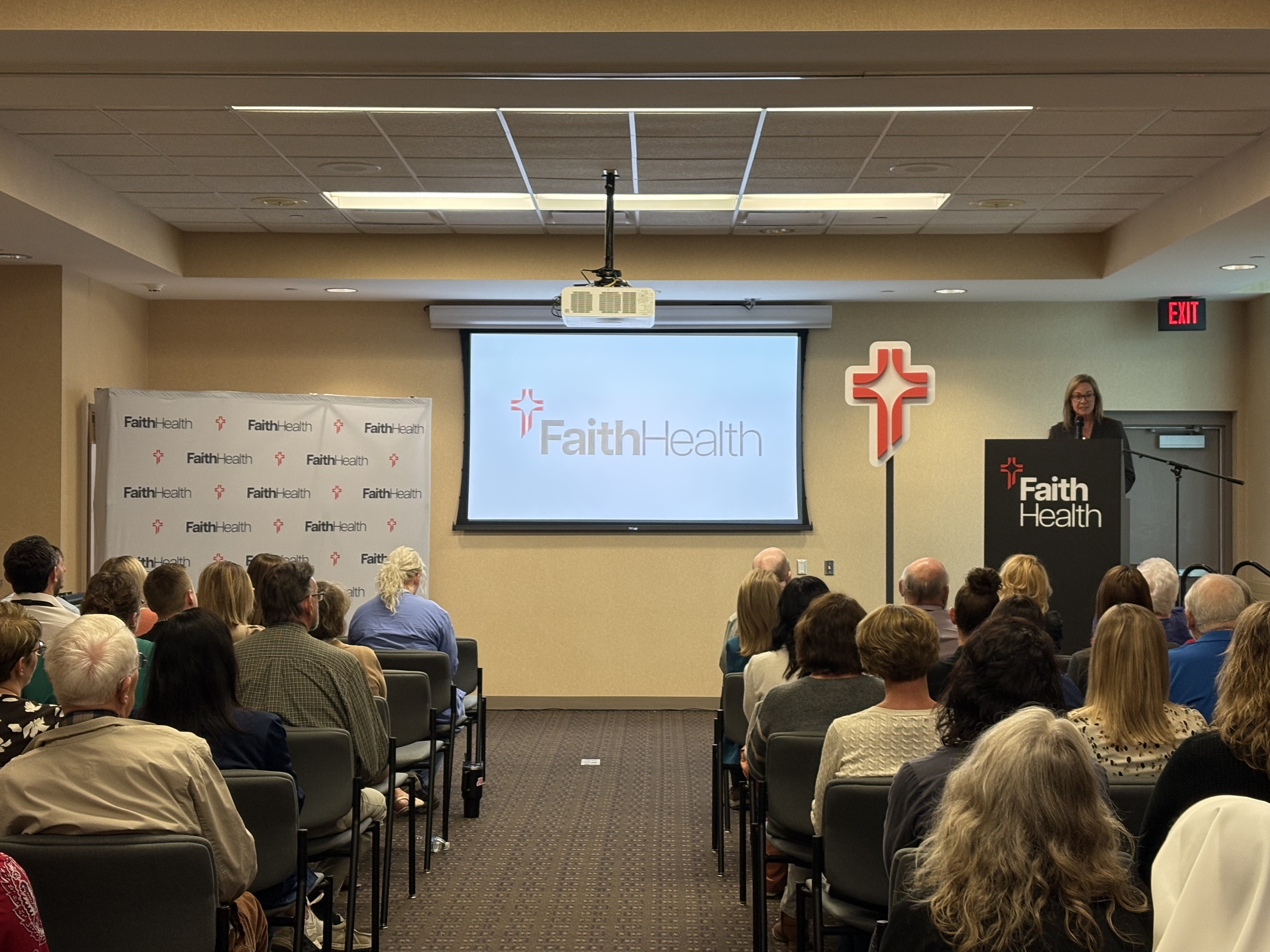 Kelly Driscoll, President and CEO, speaking at brand launch event