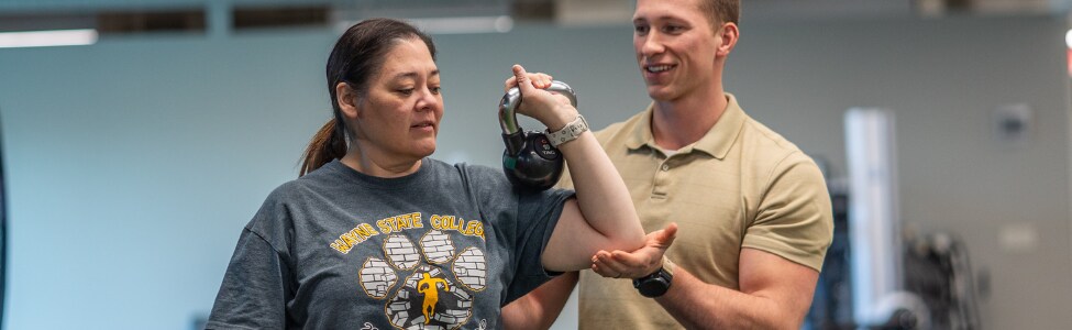 Physical Therapist, Lane Rohrich, with patient.