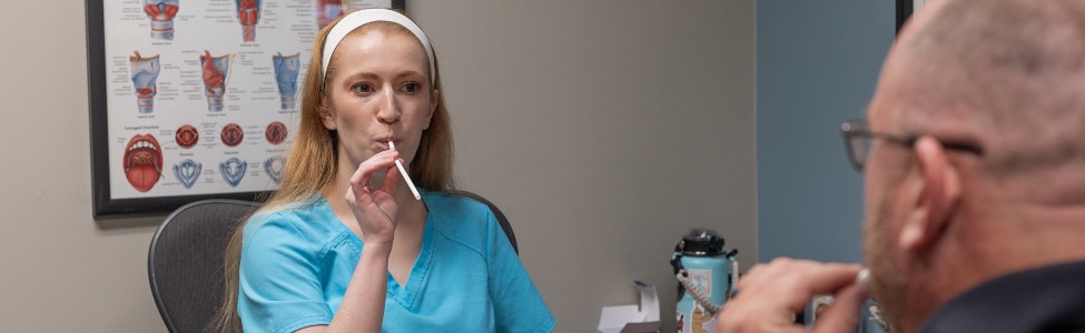 Kaylie Beach, MA, CCC-SLP with speech therapy patient