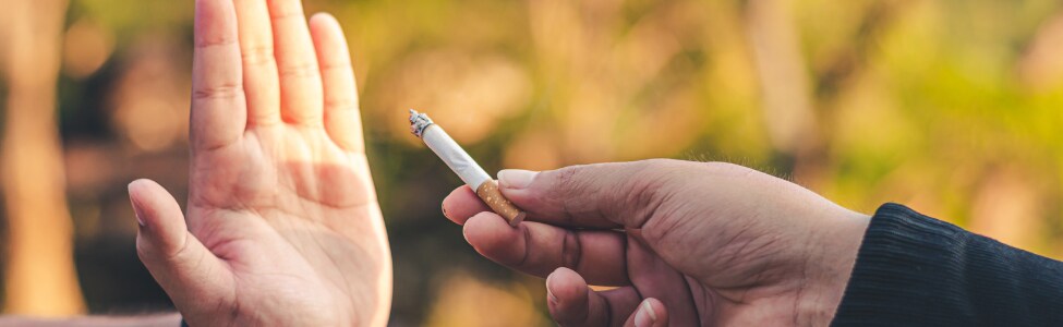 Person refusing cigarette to keep their lungs healthy